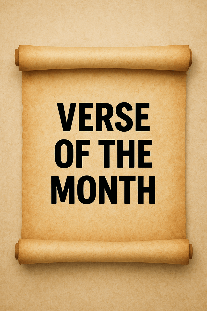 A parchment-style scroll with the words "VERSE OF THE MONTH" written in large, bold black letters in the center. The background is a light tan color, giving an antique or vintage appearance.